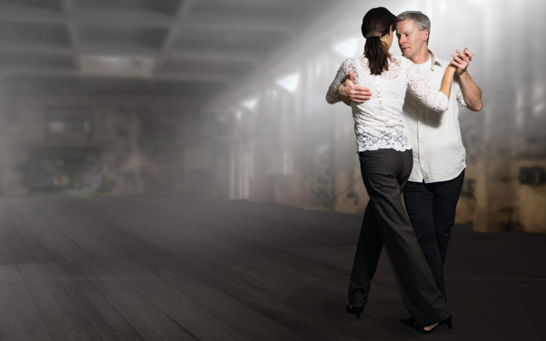 Couple dancing on time in dance lesson