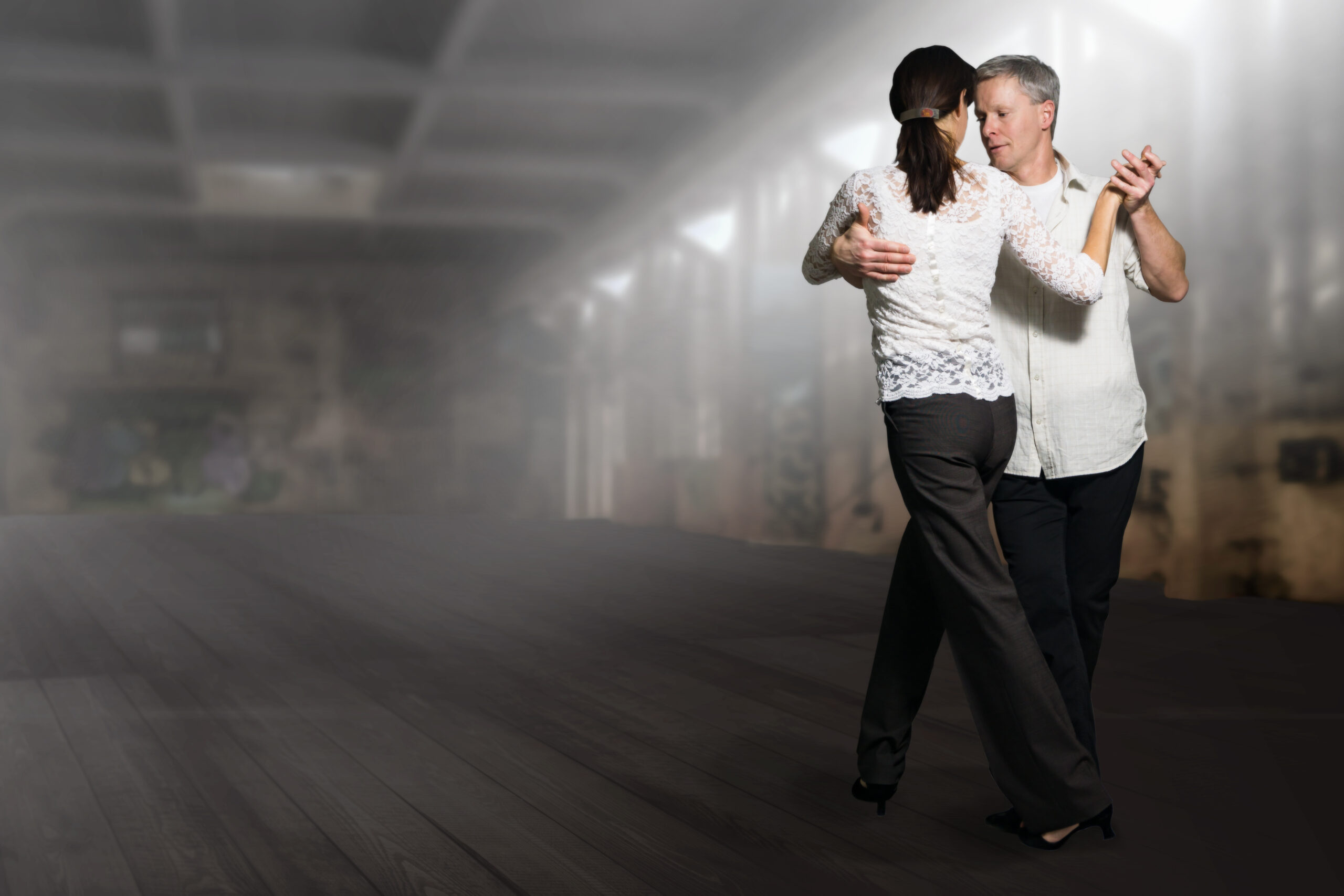 Couple dancing on time in dance lesson
