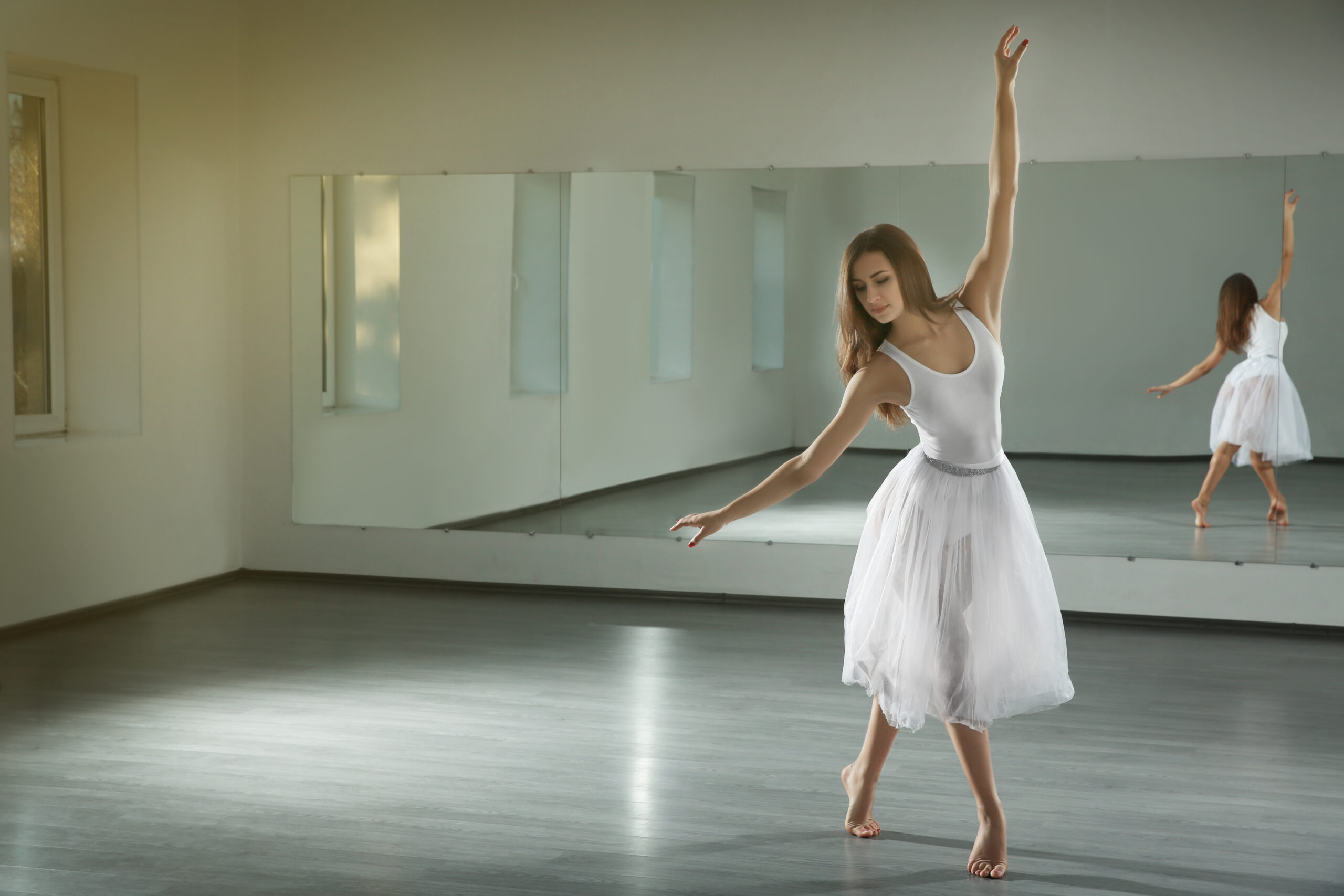 Beautiful young women dancing on a dance floor.